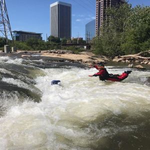 a group of people on a raft in a body of water