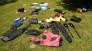 a group of lawn chairs sitting on top of a grass covered field