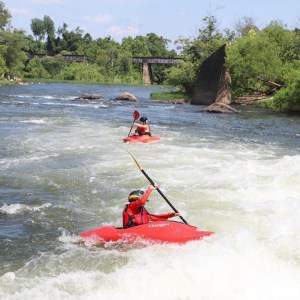 a man riding skis on a body of water