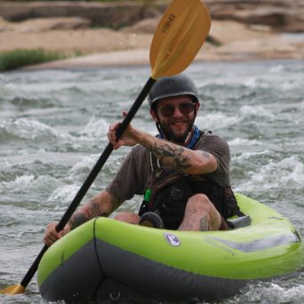 a person riding a surf board on a body of water