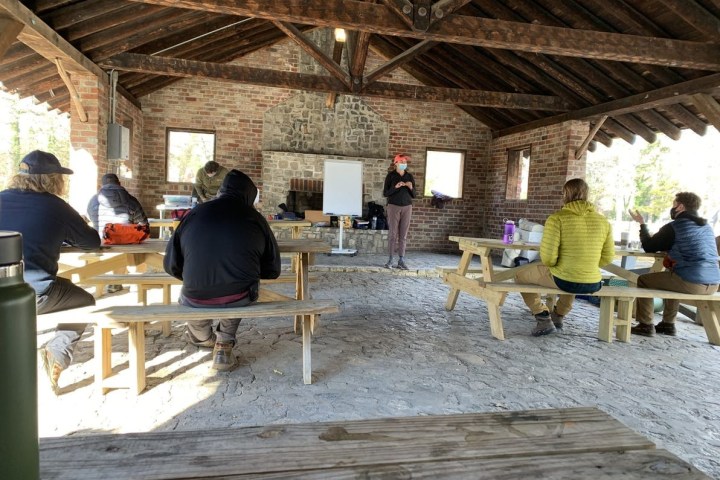 a group of people sitting on a bench