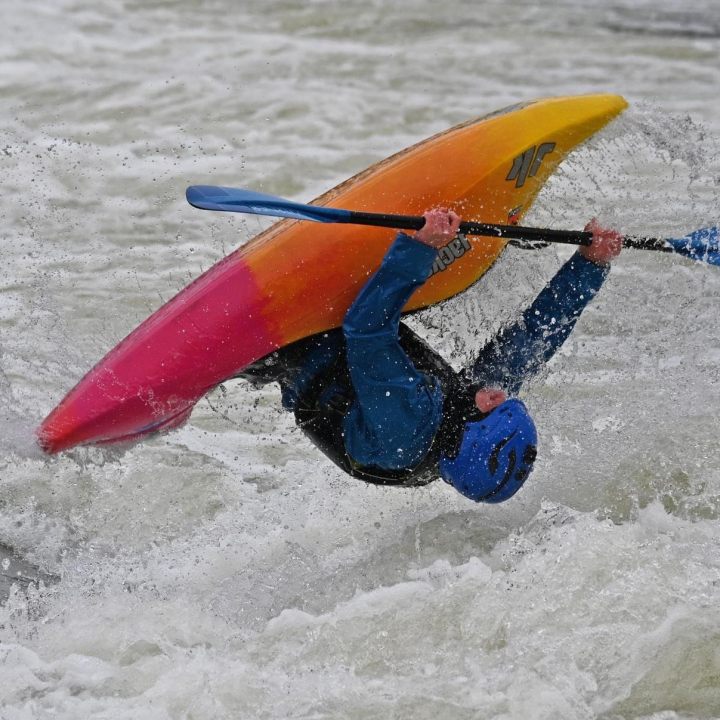 unnamed a person riding a surf board on a body of water