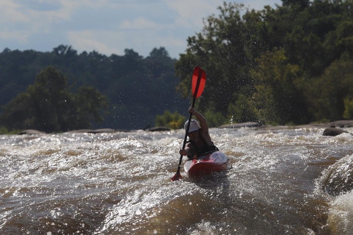 a man riding skis on a body of water