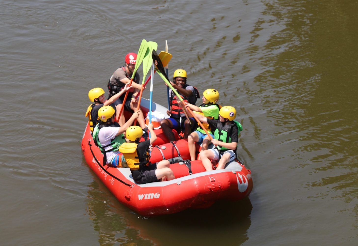 Paddle High Five in a Raft