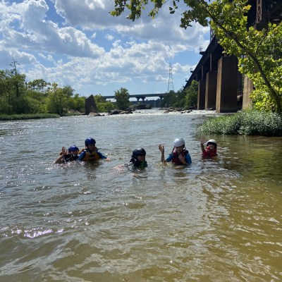 a group of people swimming in a body of water