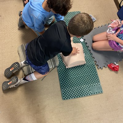 kids doing CPR