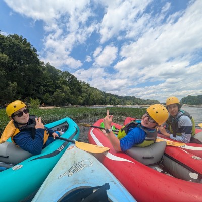 a group of people riding on the back of a boat