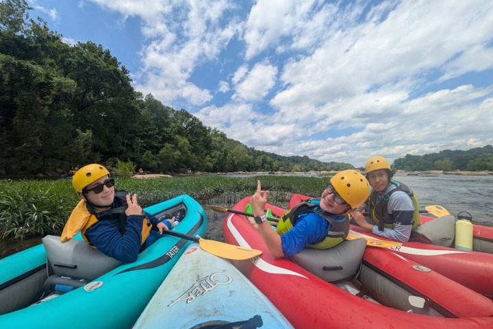 a group of people riding on the back of a boat