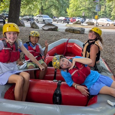 a small child sitting on a raft